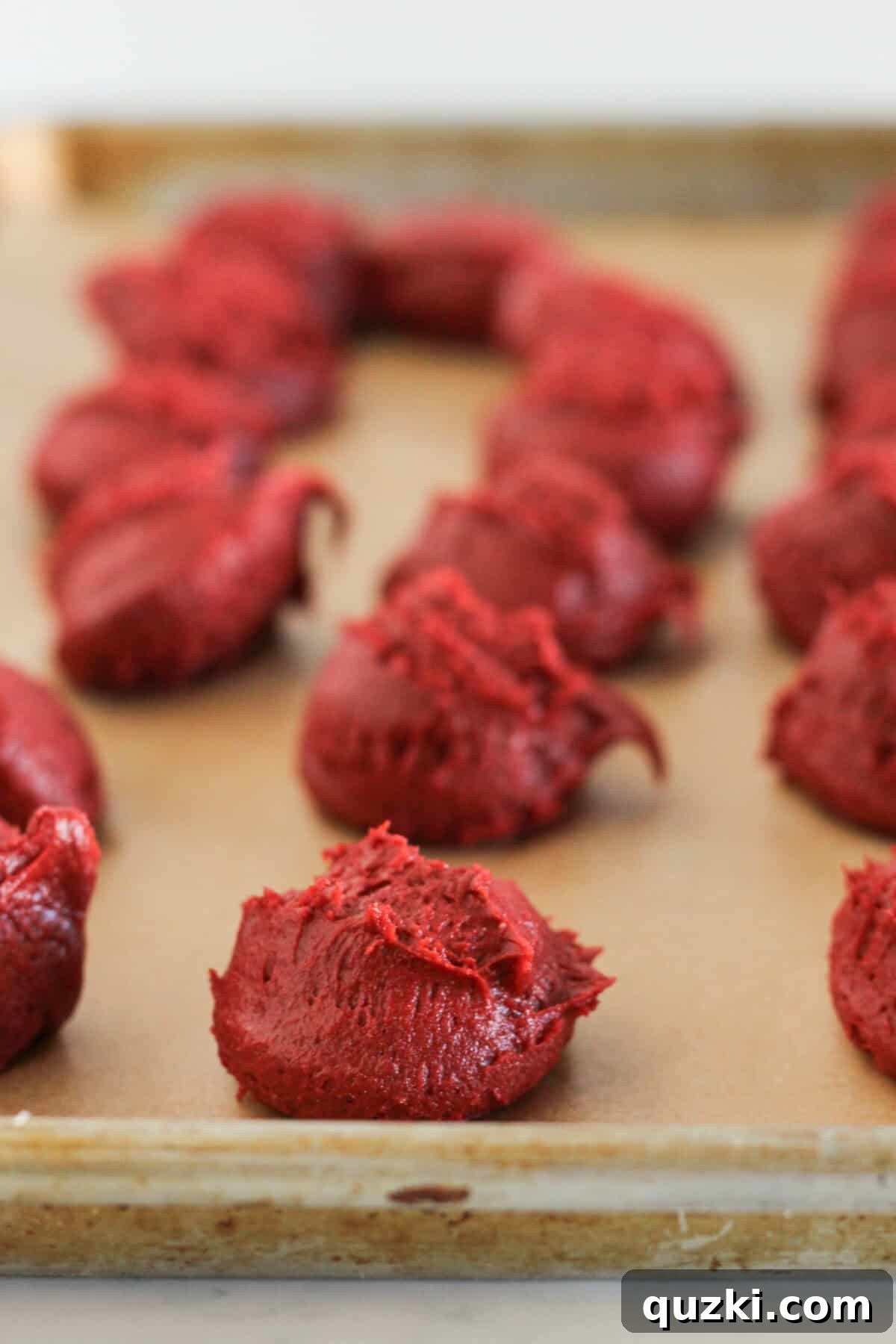 Red Velvet Whoopie Pies Made with Cake Mix 6 Scoops of red velvet cake mix cookie dough on a baking sheet to chill.