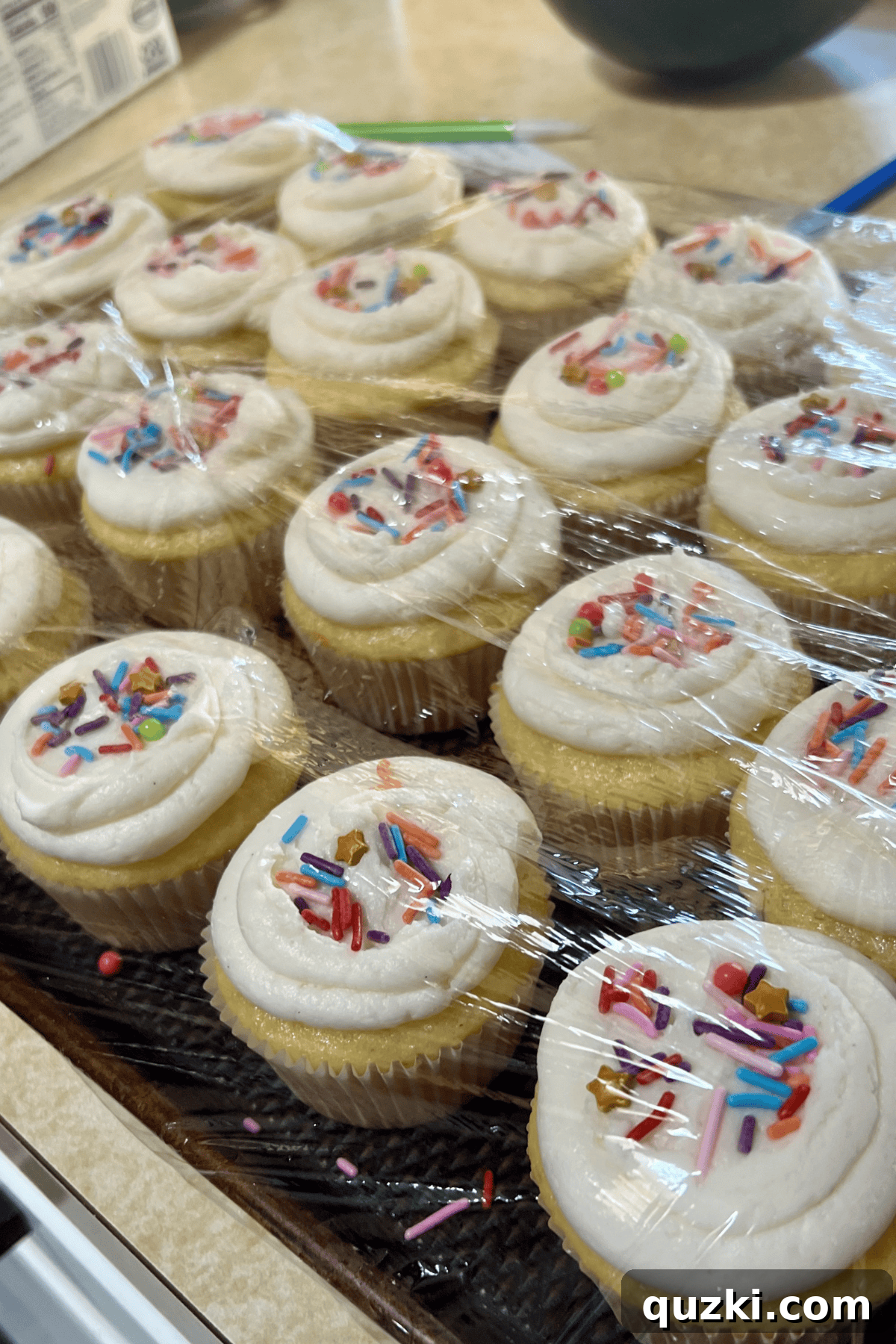 Food: How Cooking Shows Love Through Every Meal 3 Cupcakes on a tray covered in plastic wrap.