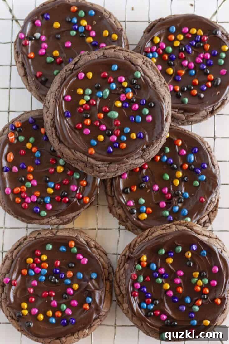 Seven Cosmic Brownie Cookies on a cooling rack.
