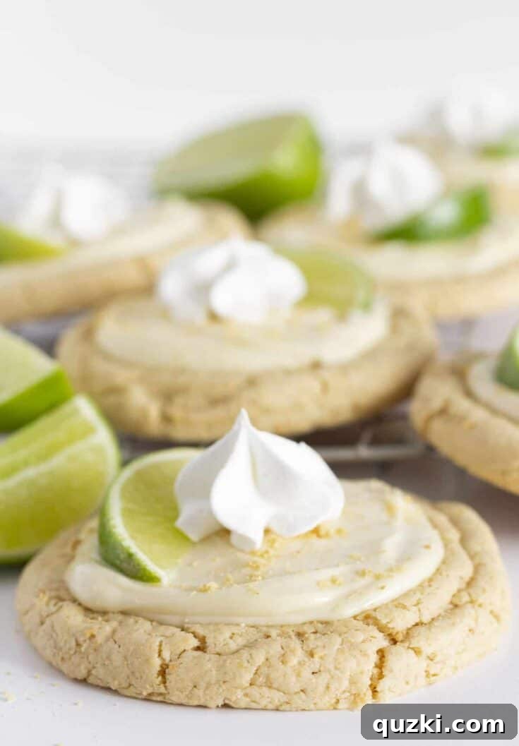 A dozen Key Lime Cookies on a cooling rack.