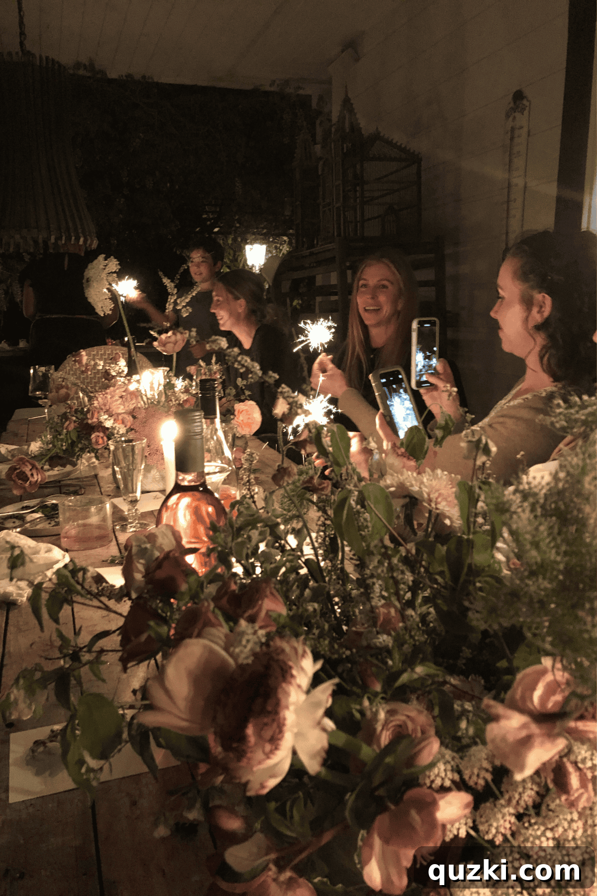 Why Dinner Parties Matter: Tips for Memorable Evenings 3 A dinner party in the dark at a candle lit table.