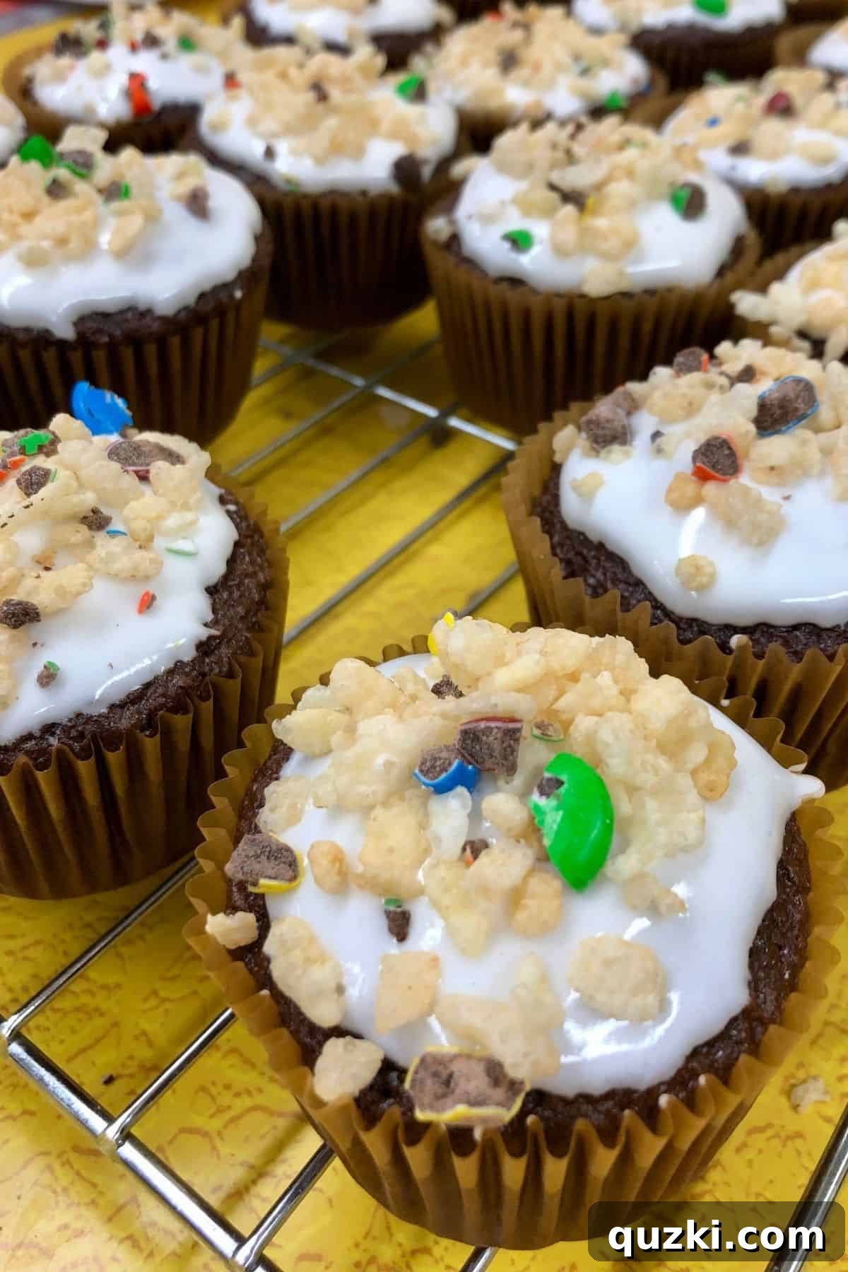 Why the Cupcakes Weren't Really the Point 2 Decorated cupcakes on a cooling rack.