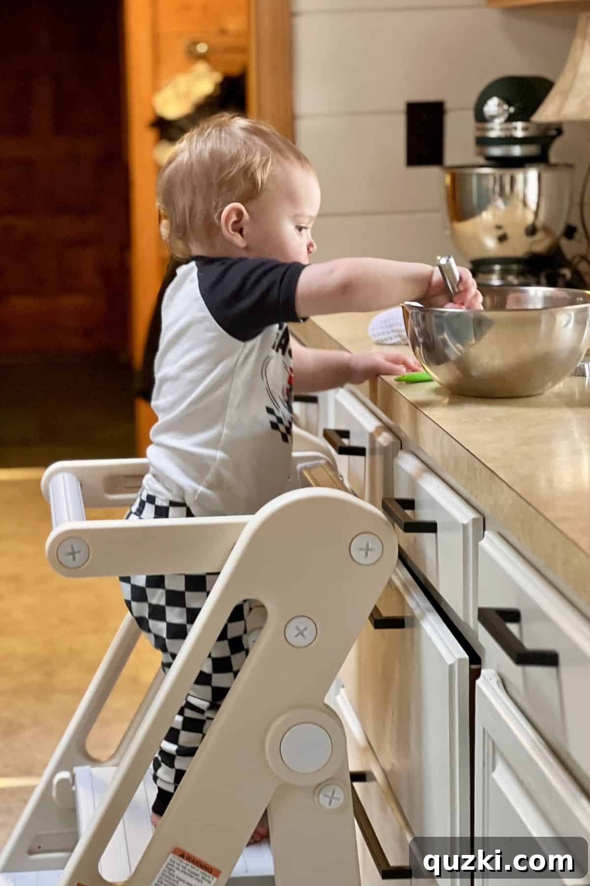 What Elliott Taught Me About the Kitchen's True Purpose 3 My grandson at the counter stirring ingredients.